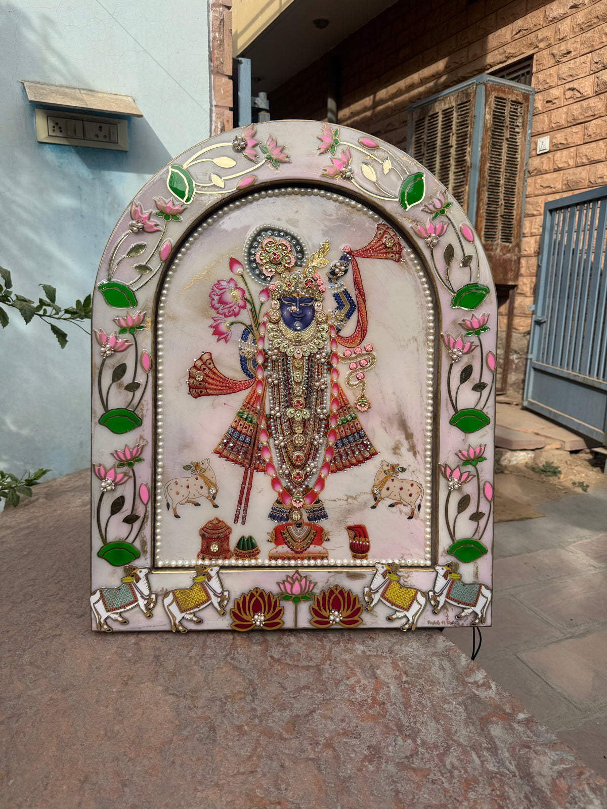 Handcrafted Shreenathji Pichwai arch wall decor with pearl border, lotus motifs and floral embellishments