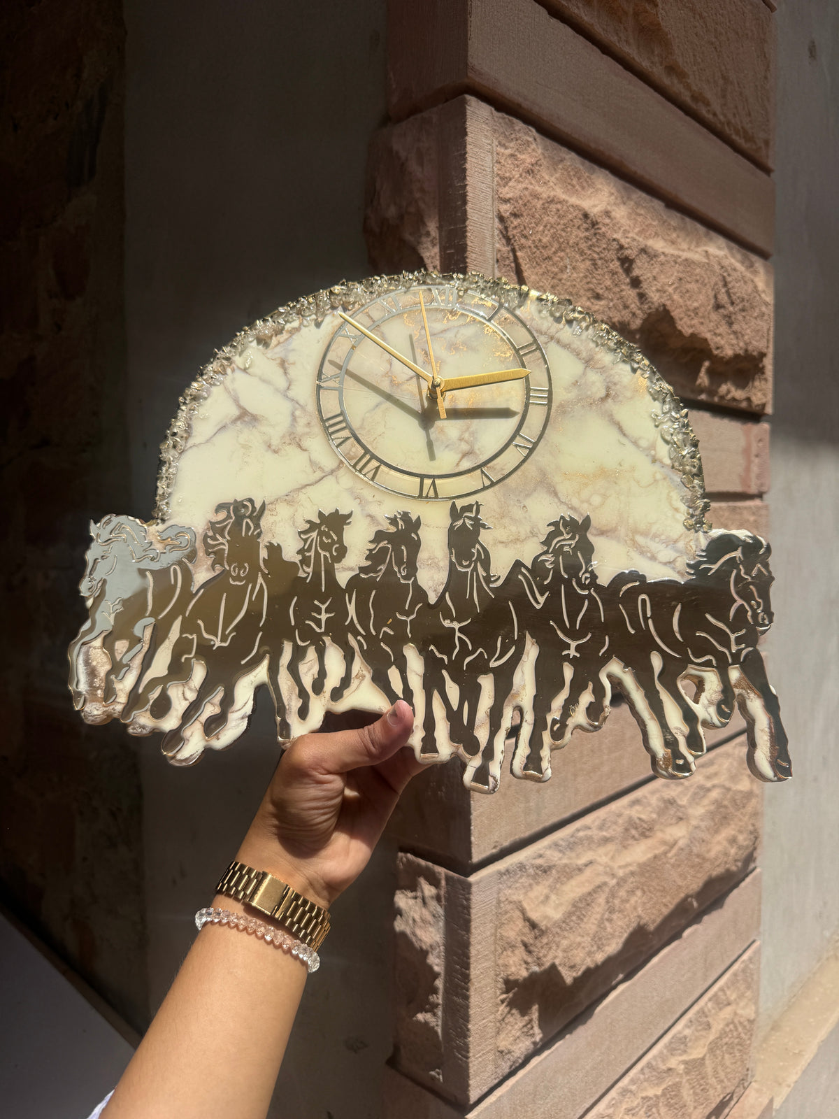 Handcrafted marble effect wall clock with Roman numerals, gold hands and running horse silhouette