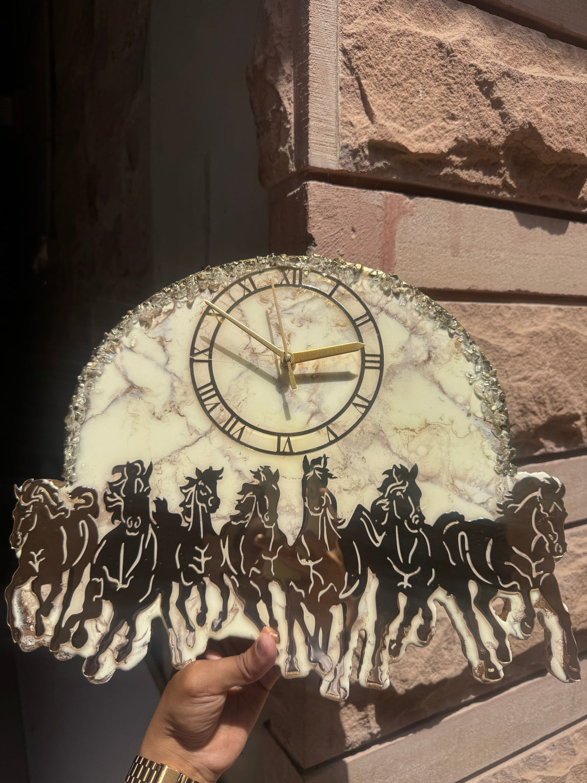 Handcrafted marble effect wall clock with Roman numerals, gold hands and running horse silhouette