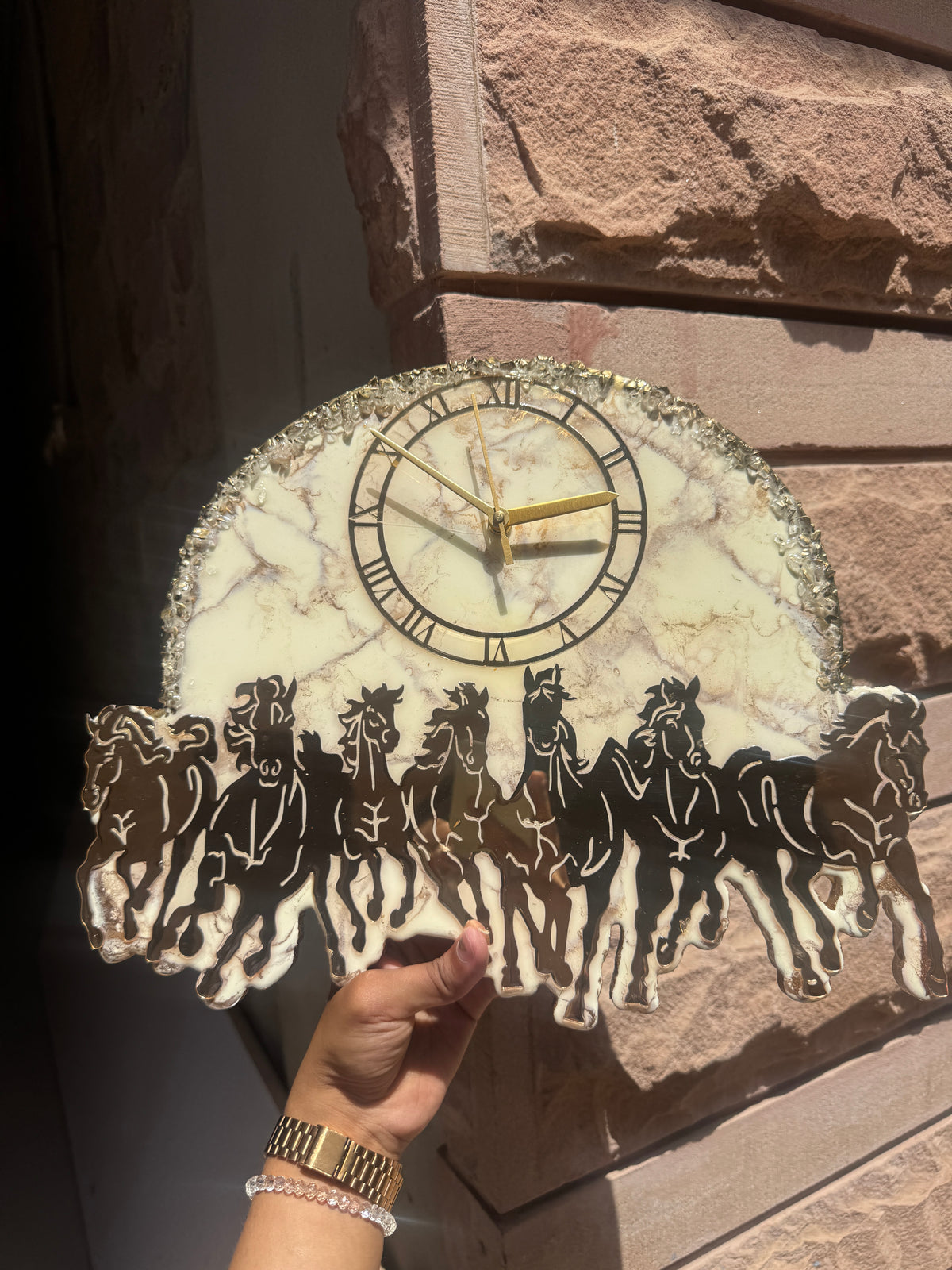 Handcrafted marble effect wall clock with Roman numerals, gold hands and running horse silhouette